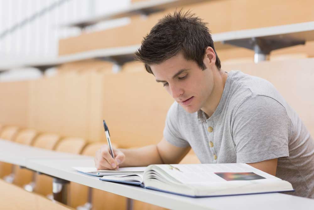 student reading at university